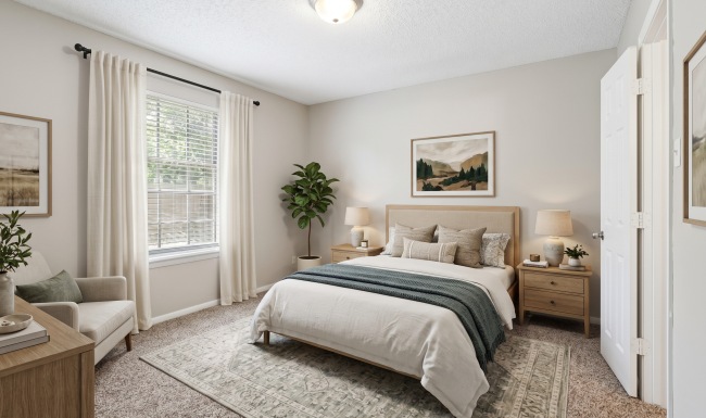 bedroom with bed, night stands, and dresser
