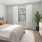 Bedroom with natural lighting and high ceilings