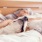 dog sleeping on bed with his owner
